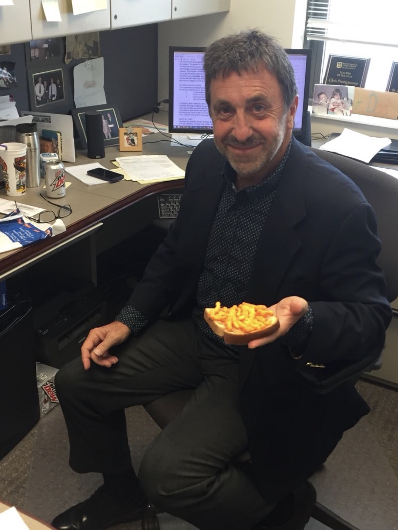 Dr. P eating peanut butter sandwich with Cheetos
