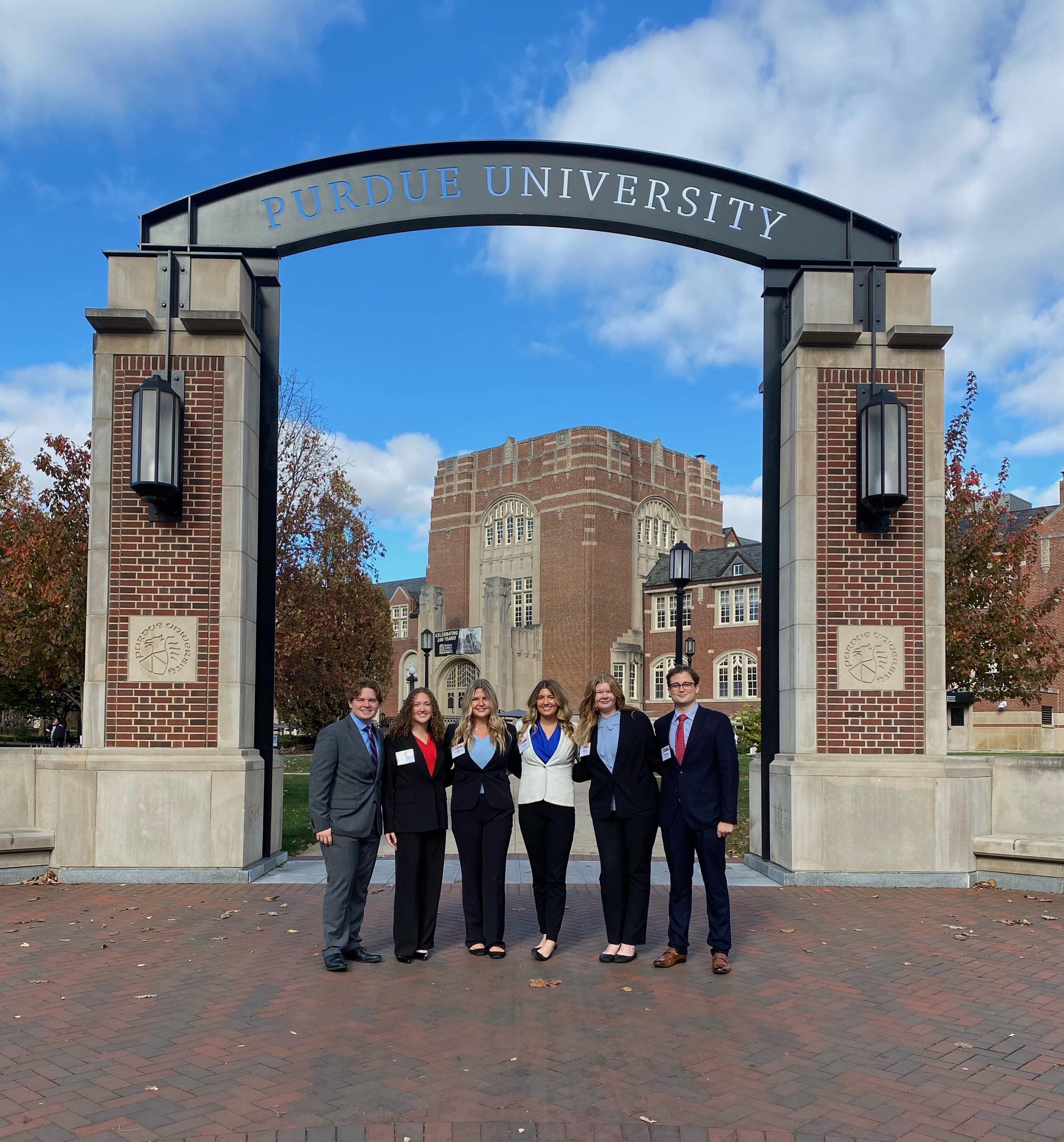 Image: students pose in front of Purdue University 