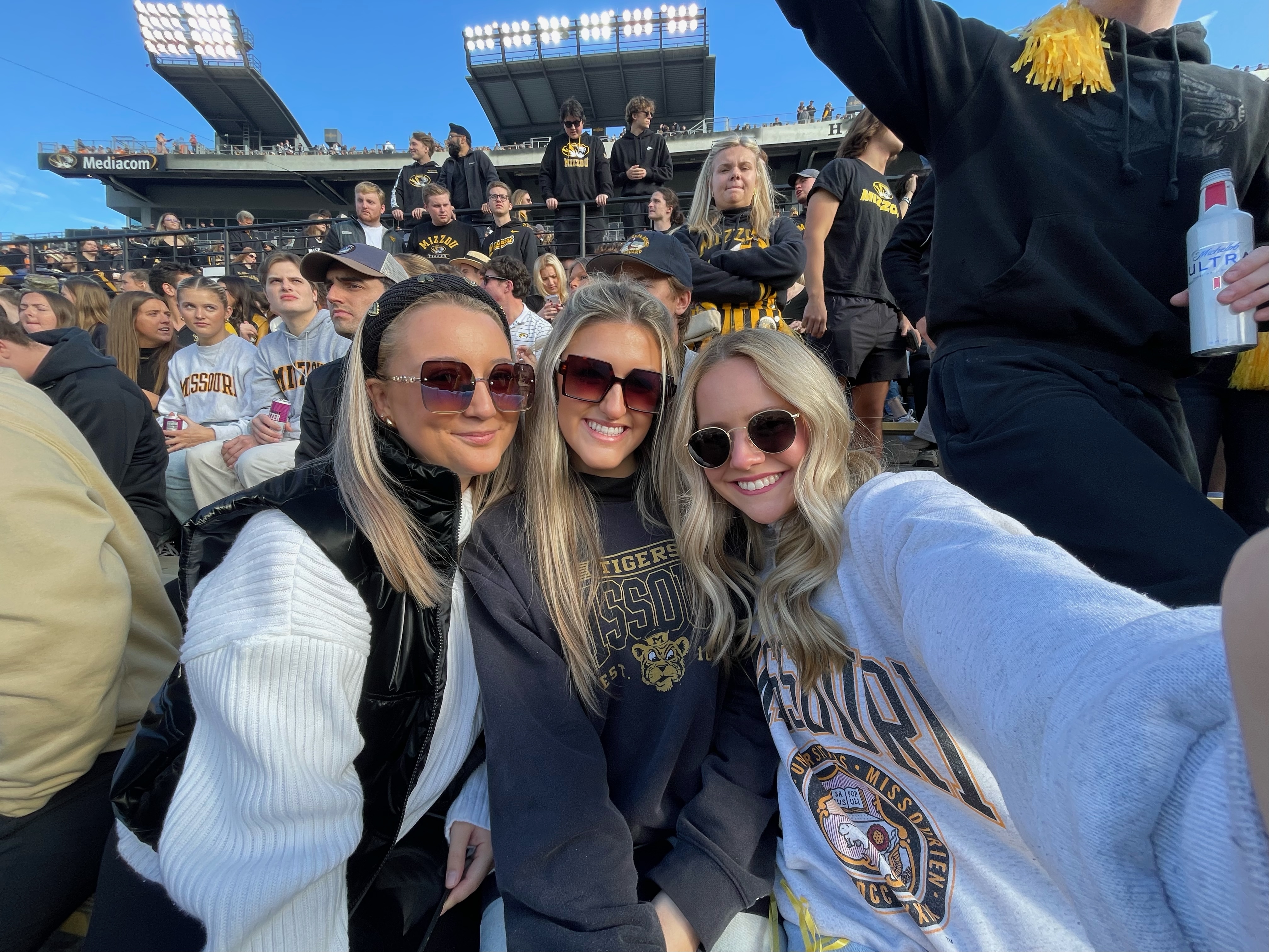 Hannah with friends at game.