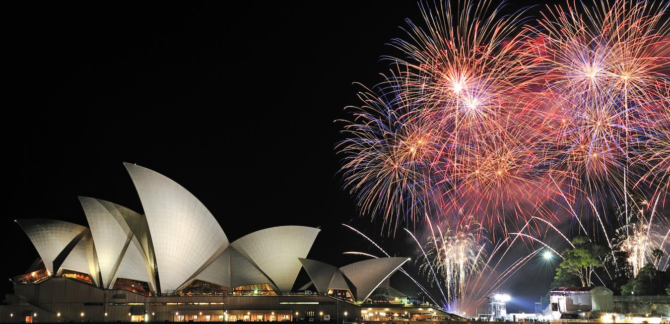 Sydney Harbor House with fireworks above
