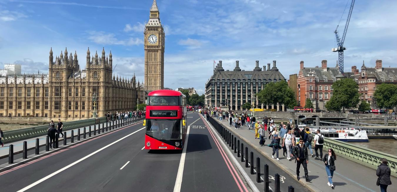 London Street with red bus and bustling sidewalk