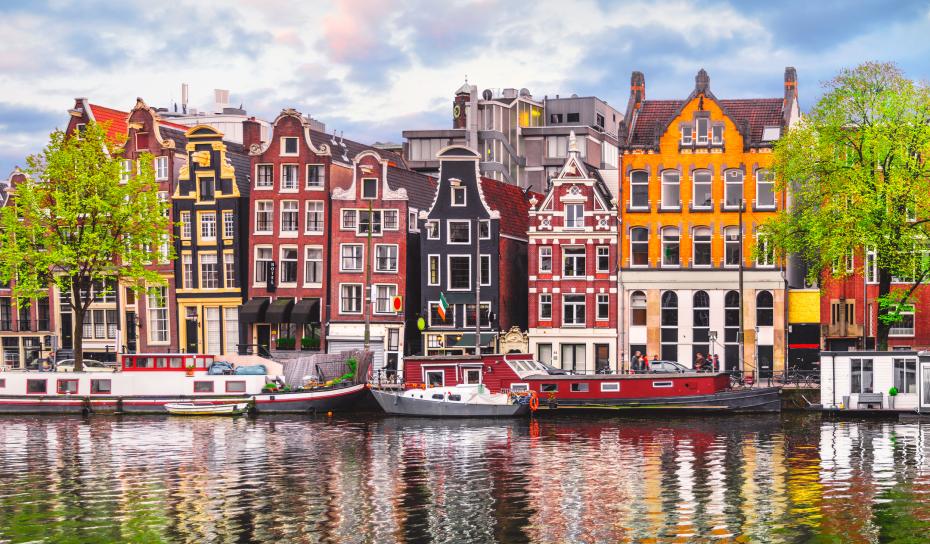 Houses lining the Amstel River in Amsterdam, Netherlands