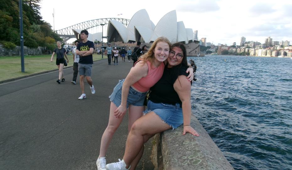 2 students posing for a photo with Sydney Opera House in the background