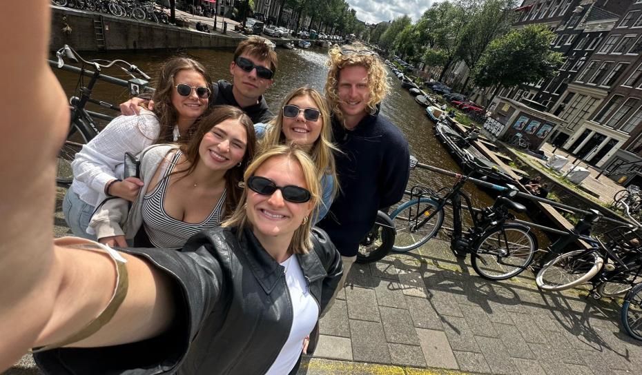 London students on a stroll by a waterway