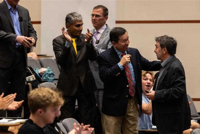 MU President Mun Choi congratulates Professor Chris Prestigiacomo on receiving the Kemper Award.