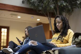 Image: Two female students studying in Cornell Hall.