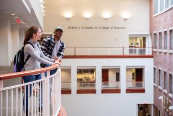 Image: Two students overlooking the atrium in Cornell Hall.