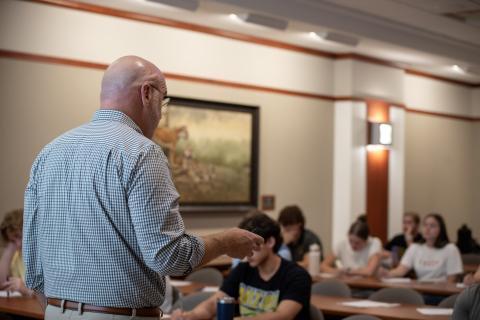 Phil talking with students