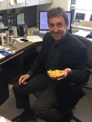Dr. P eating peanut butter sandwich with Cheetos