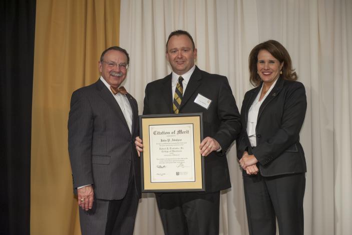 Image: John Abshear receiving the Citations of Merit  