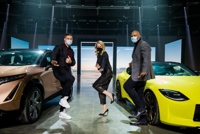 Heisman Trophy winners Tim Tebow and Eddie George appear next to Nissan cars with Nissan executive Allyson Witherspoon.