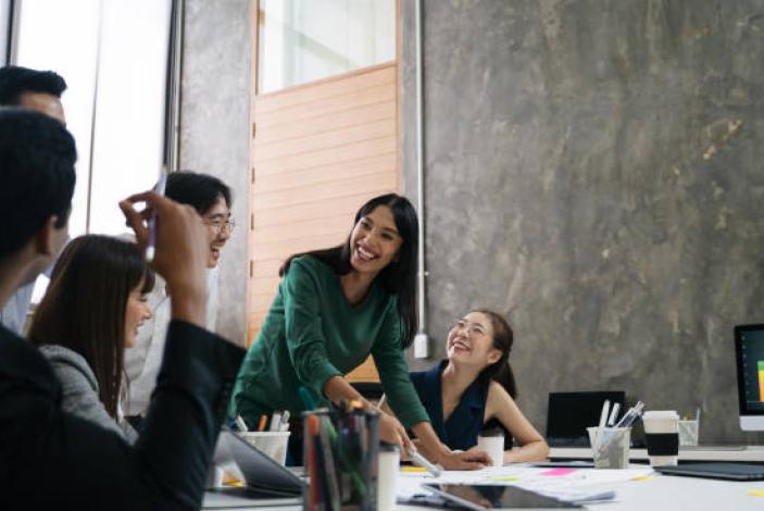 Image: Group of people laughing in the workplace