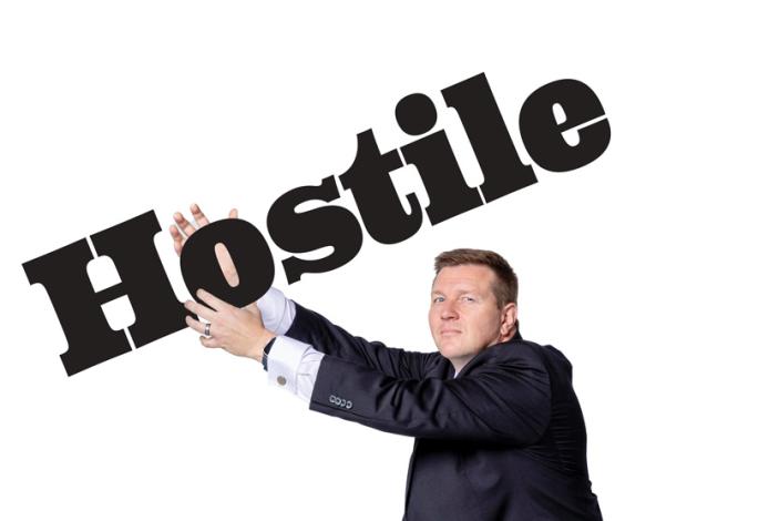 Adam Yore posing with the word "hostile"