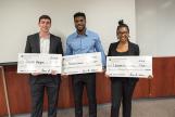 Image: CEI Venture pitch competition top 3 finishers, Joseph Hagan, Nathan Brown and Lauren Williams, holding big checks.