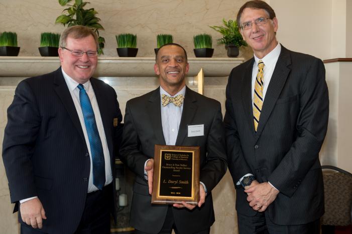 Image: L Daryl Smith receives the Bruce and Pam Walker Outstanding Faculty Service Award 