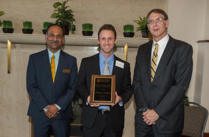 Image: Nate Newton receiving the Excellence in Teaching Award