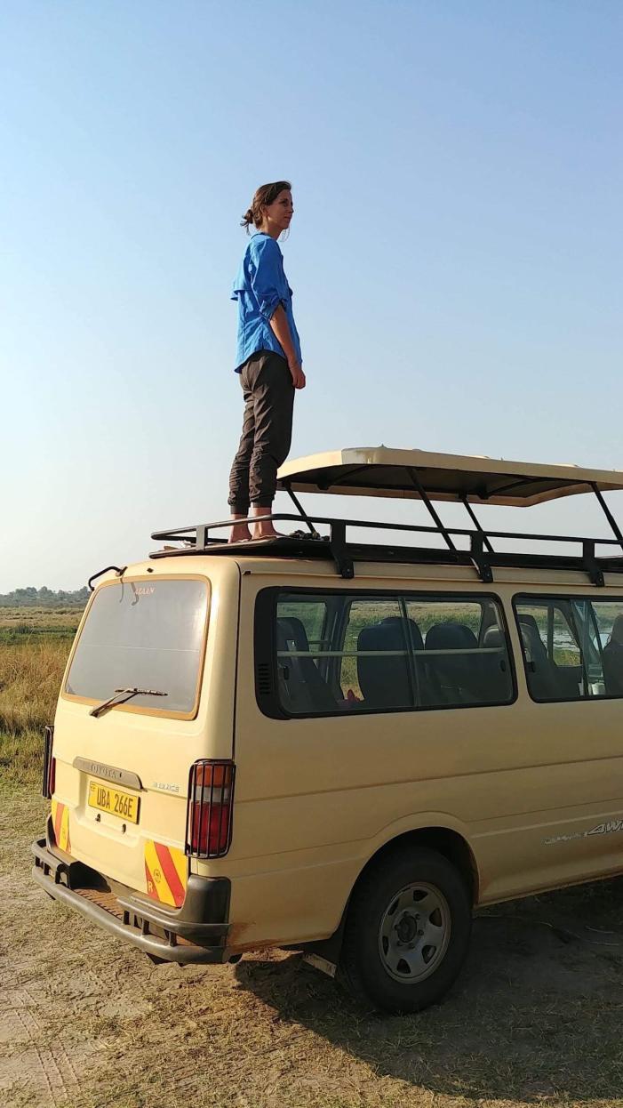 Haley Block stands atop a safari van in Uganda’s Murchison Falls National Park in 2018.