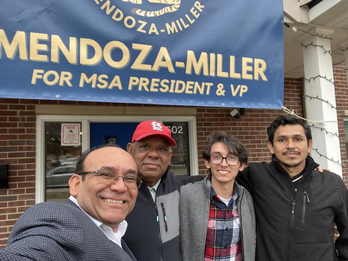 Josiah Mendoza with family in front of MSA campaign sign
