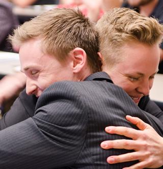 Team House Collars hugs after they are announced the winners of first prize.