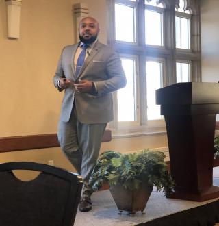 Image: Marcus Brown speaks at the Bottom Line for Diversity Conference