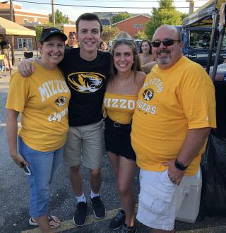 Connor Lovelace at football tailgate with family