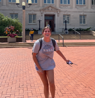 Grace Casey in front of Ellis Library