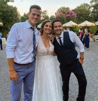 Andy Butler poses with Alberto Pievani and his sister Guilia at Guila’s wedding last summer. 