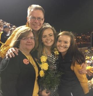 Allison Fitts with her family at the 2015 Homecoming.